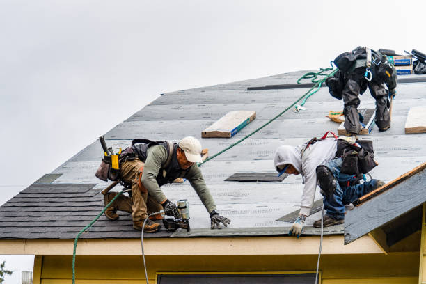 Professional Storm Damage Roof Repair technician working in North Hampton, NH